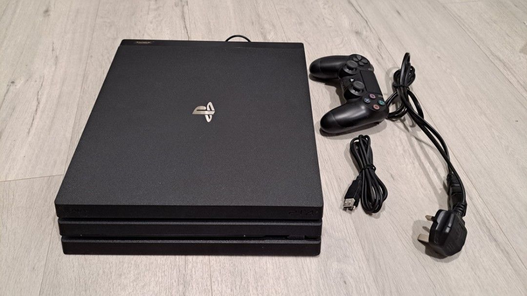 PS4 Pro (Category: PlayStation) located in Singapore. Submitted by dryxyz (Listing ID 1357675475, Image 1). Description: 1 TB PS4 pro with cooling fan attachment & lightly used controller.