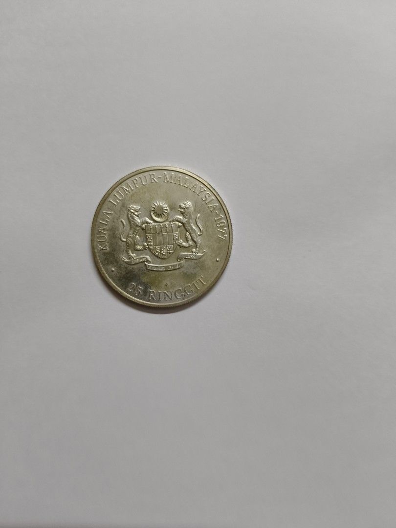 25 ringgit coin (Category: Currency) located in Singapore. Submitted by spiderman58 (Listing ID 1364094476, Image 2). Description: 25 ringgit Malaysian coin.