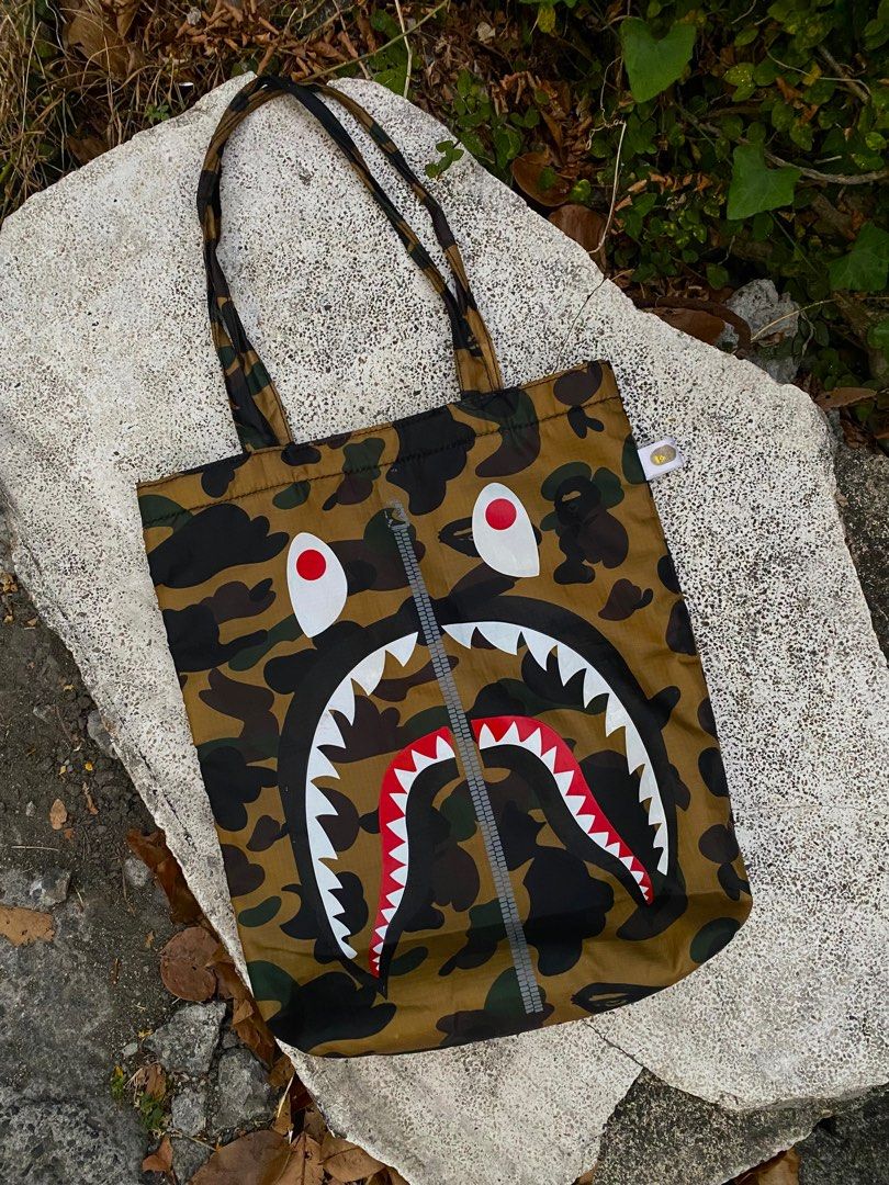 A BATHING APE BAPE SHARK TOTE BAG (Category: Luxury Bags & Wallets) located in Imus. Submitted by swizzythriftshop (Listing ID 1364154351, Image 1). Description: A BATHING APE BAPE SHARK TOTE BAG 999 MINIMAL ISSUE EXCELLENT CONDITION .