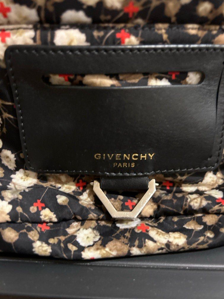 Authentic Givenchy Backpack (Category: Bags & Wallets) located in Singapore. Submitted by diva_mama (Listing ID 1240052786, Image 2). Description: Preloved Authentic Givenchy backpack Iconic flower design Estimated measurements: 25cm x 30cm Hardly used Selling much cheaper than retail price to clear space Low ballers stay away please. Serial code tag in good condition Comes with dust bag Sale will be final no refund return or exchange after deal.
