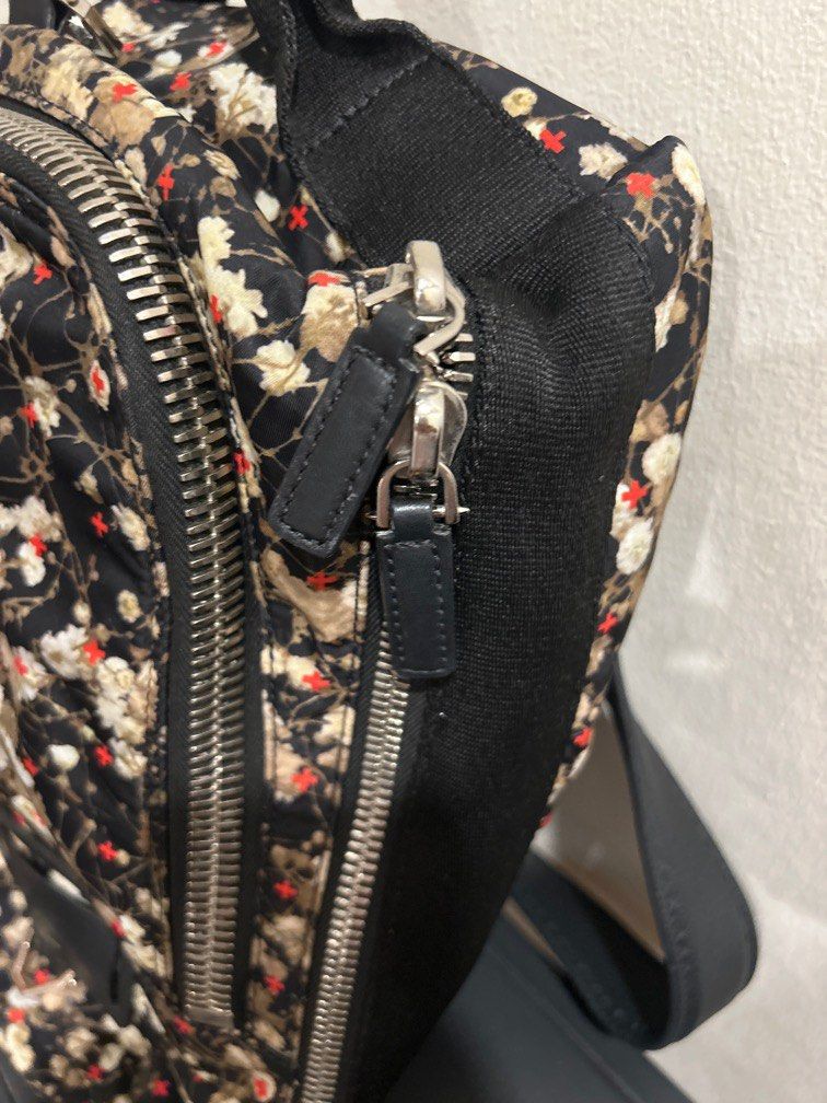 Authentic Givenchy Backpack (Category: Bags & Wallets) located in Singapore. Submitted by diva_mama (Listing ID 1240052786, Image 3). Description: Preloved Authentic Givenchy backpack Iconic flower design Estimated measurements: 25cm x 30cm Hardly used Selling much cheaper than retail price to clear space Low ballers stay away please. Serial code tag in good condition Comes with dust bag Sale will be final no refund return or exchange after deal.