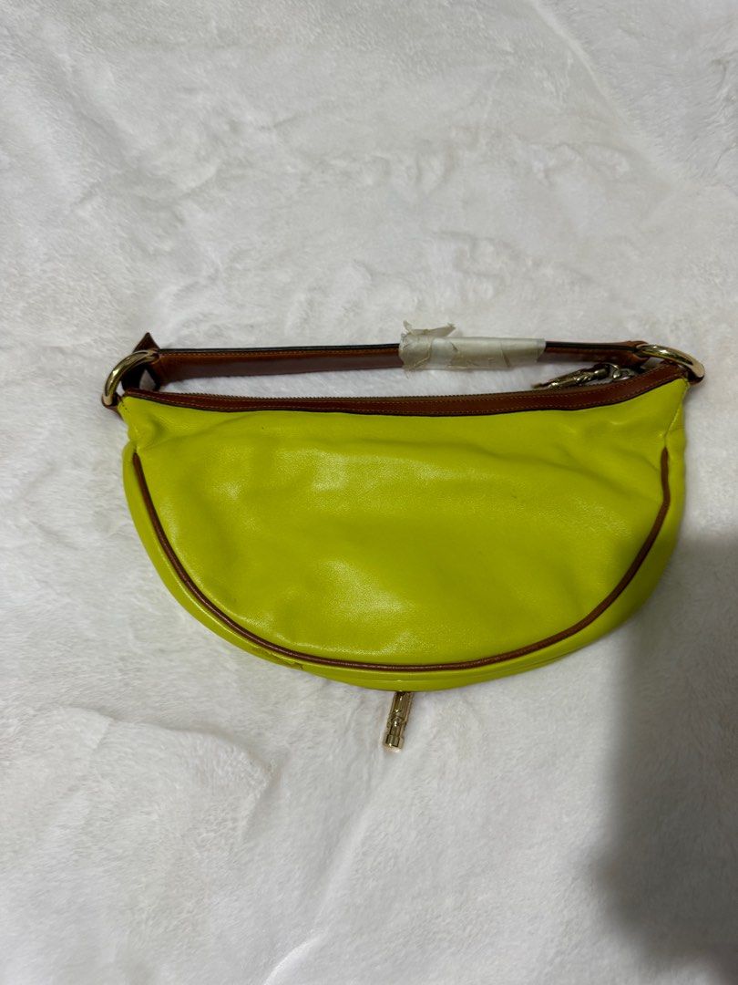 Authentic Versace Yellow Leather Half Moon with Charm (Category: Luxury Bags & Wallets) located in Paranaque City. Submitted by authentic_mj (Listing ID 1364123673, Image 2). Description: Never been used Authentic Versace Yellow Leather Half Moon with Charm Clutch Handbag Bought in Saudi Arabia No inclusions Flaws: tarnish metal.