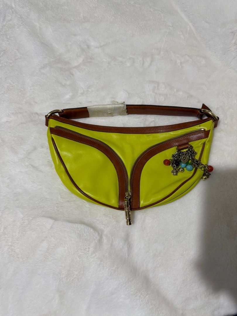 Authentic Versace Yellow Leather Half Moon with Charm (Category: Luxury Bags & Wallets) located in Paranaque City. Submitted by authentic_mj (Listing ID 1364123673, Image 1). Description: Never been used Authentic Versace Yellow Leather Half Moon with Charm Clutch Handbag Bought in Saudi Arabia No inclusions Flaws: tarnish metal.