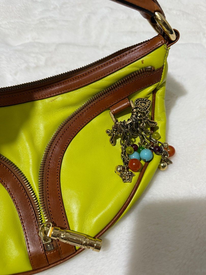 Authentic Versace Yellow Leather Half Moon with Charm (Category: Luxury Bags & Wallets) located in Paranaque City. Submitted by authentic_mj (Listing ID 1364123673, Image 3). Description: Never been used Authentic Versace Yellow Leather Half Moon with Charm Clutch Handbag Bought in Saudi Arabia No inclusions Flaws: tarnish metal.