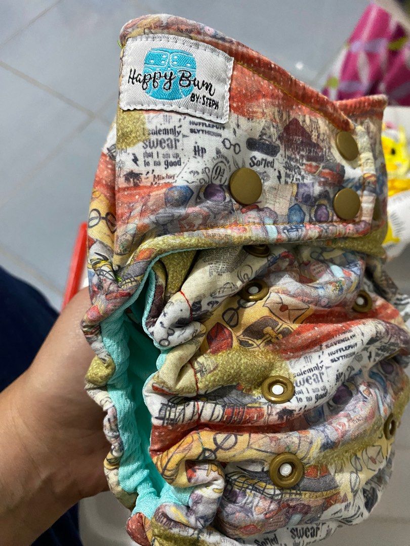 Cloth Diapers - Harry Potter (Category: Diapers & Baby Wipes) located in Zamboanga. Submitted by zamboutique (Listing ID 1364142308, Image 2). Description: Personal Preloved Cloth Diaper Rating EUC - Used less than 5x My MTO from Happy Bum By Steph Hybrid Fitteds Inner Lining - AWJ Teal/Light Green Elastics, Snaps Intact NO ISSUES No holes Original Trifold Insert - Forgot the cloth/blends. Sorry. STORED FOR LONG TIME. Need to disinfect and strip!