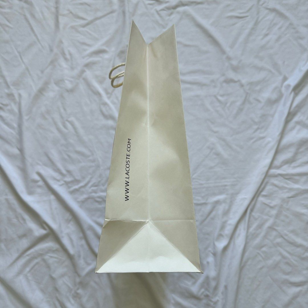 Lacoste Paper Bag (Category: Luxury Bags & Wallets) located in Paranaque City. Submitted by contactcars (Listing ID 1063013097, Image 3). Description: RFS: Decluttering by getting rid of old boxes / paper bags. From a bag bought at Lacoste Glorietta. Dimensions: 16.25W x 12H x 4.75D inches.