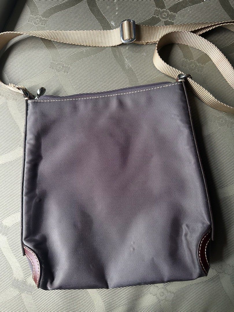 Lancel Nylon Crossbody Bag (Category: Luxury Bags & Wallets) located in Makati City. Submitted by kobeskorner (Listing ID 1364081729, Image 3). Description: Lancel Nylon Crossbody Bag Vintage handbag from the 90s by LANCEL Paris in brown nylon and leather The interior is in brown canvas with the Lancel Paris logo. There are no stains, no snags or holes 24 x 26 x 5 cm.