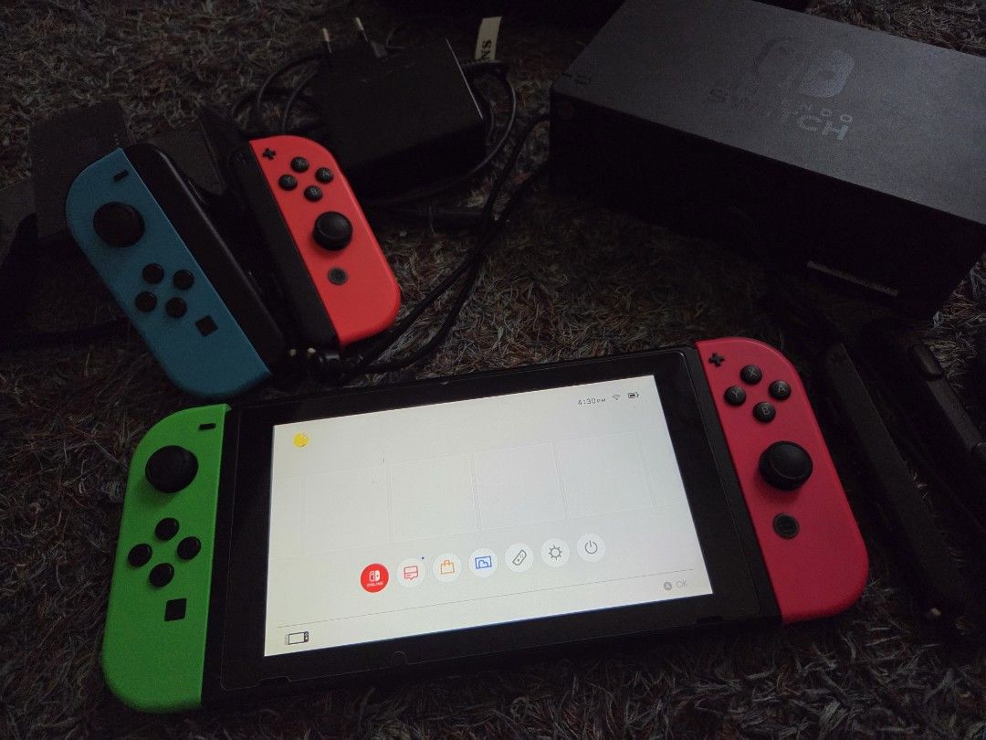 Nintendo Switch (Category: Nintendo) located in Pasig City. Submitted by seisei20 (Listing ID 1364139221, Image 2). Description: Selling my Nintendo Switch 64 GB Memory Card Includes: -- 4 controllers All working controllers incl wirelessly Blue - Stick drift Green - does not connect directly to the console, but charges, can be used bec its wireless. -- USB charger -- HDMI cord -- stand -- Case please see pics..