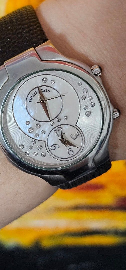 Philip Stein Signature with Diamonds (Category: Luxury Watches) located in Manila. Submitted by shyysandig (Listing ID 1364100272, Image 3). Description: FS: RARE Philip Stein Signature Discontinued model Classic Round Dual time With natural mined diamonds on dial with cabochon crowns Natural Frequency Technology Size 1/ Small size With brand new black leather bracelet 09190088845.