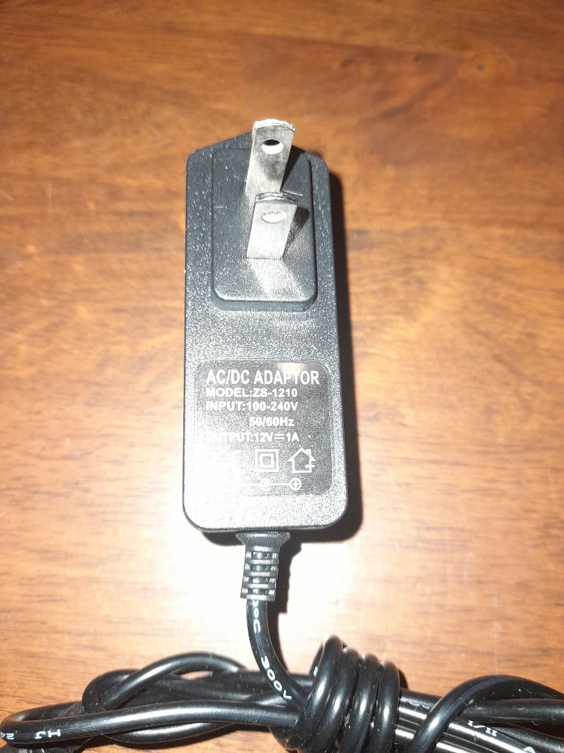 Power Supply ZS-1210 (Category: Chargers) located in Las Pinas. Submitted by ninodpmas (Listing ID 1364219071, Image 2). Description: Power Supply Model: ZS-1210 Input: 100-240V~ 50/60Hz Output: 12V= 1A.