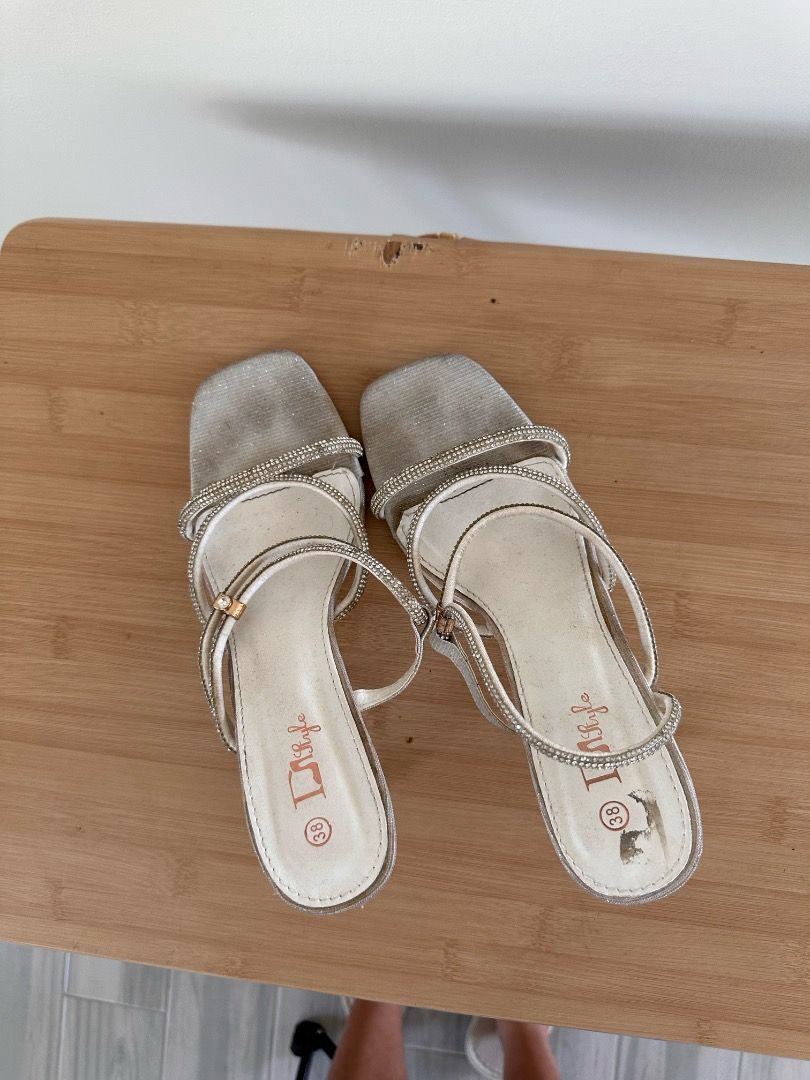 Silver open toe with strap on heels Size 38 (Category: Heels) located in Binan City. Submitted by themkeps (Listing ID 1364083485, Image 3). Description: Used for ball worn once tried to wash but the black marking is not coming off unknown brand comes with box .