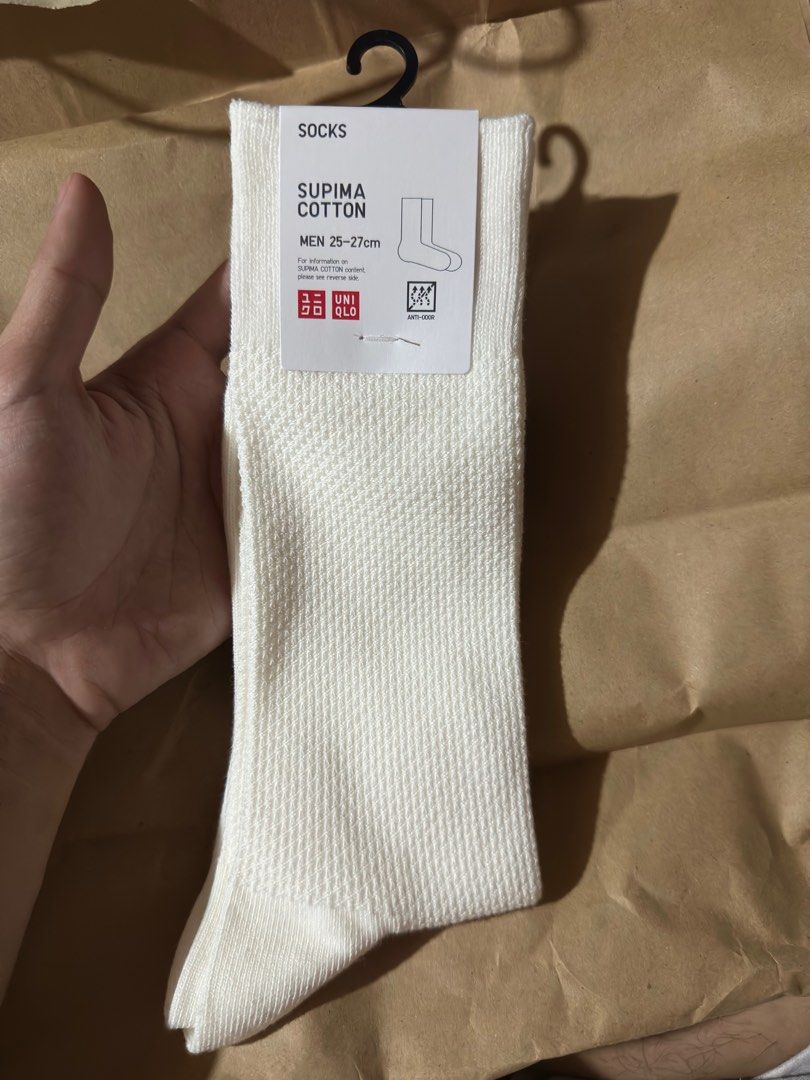 Uniqlo Socks 3 sets White KAWS (Category: Socks) located in Angeles City. Submitted by simon_02 (Listing ID 1364133390, Image 1). Description: Sets only Never been used. Naalis lang sa tag yung isa pero never nagamit..