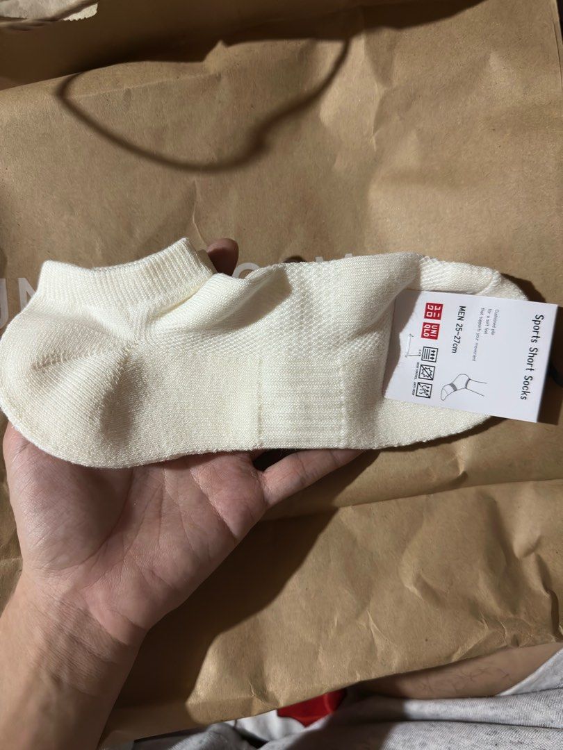 Uniqlo Socks 3 sets White KAWS (Category: Socks) located in Angeles City. Submitted by simon_02 (Listing ID 1364133390, Image 3). Description: Sets only Never been used. Naalis lang sa tag yung isa pero never nagamit..