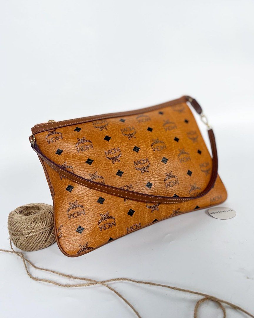 Authentic Preowned MCM pochette cognac bag (Category: Luxury Bags & Wallets) located in San Pablo. Submitted by misskittyph (Listing ID 1364248026, Image 1). Description: Cognac Visetos Pochette Clutch/Shoulder Bag ▪️9.5k . 8.9/10 condition Tolerable corner rubs Generic dustbag Layaway options available 💯Guaranteed authentic or your money back .