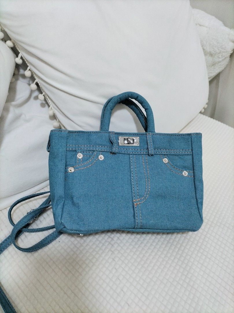 Denim bag (Category: Cross-body Bags) located in Singapore. Submitted by uniceinice (Listing ID 1364288629, Image 1). Description: measurements length 20cm"height 15cm"width8cm long strap adjustable. brand new never used. sell as is it . only meet up at my location..