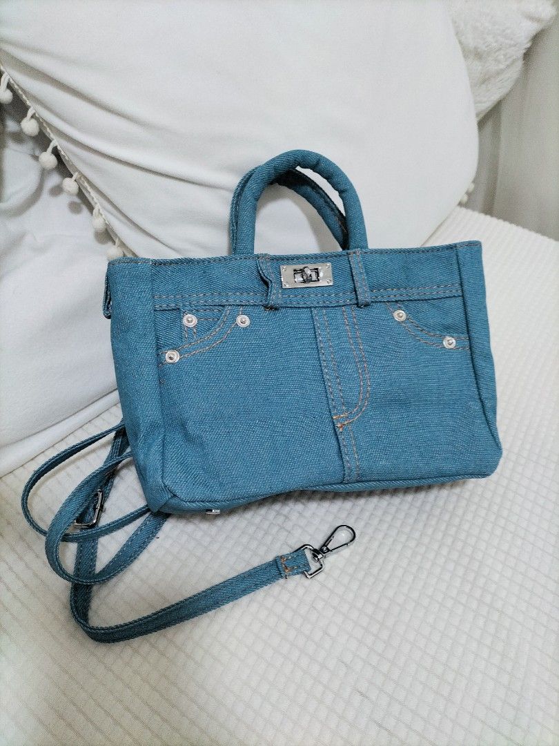 Denim bag (Category: Cross-body Bags) located in Singapore. Submitted by uniceinice (Listing ID 1364288629, Image 2). Description: measurements length 20cm"height 15cm"width8cm long strap adjustable. brand new never used. sell as is it . only meet up at my location..