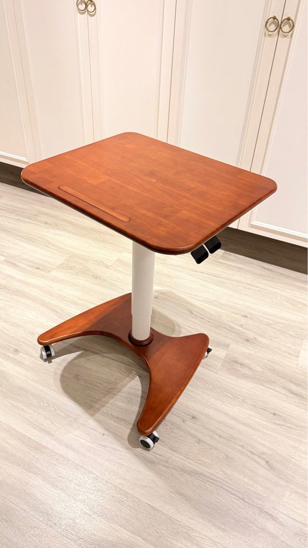 Adjustable height study table (Category: Tables & Sets) located in Singapore. Submitted by katherine_0 (Listing ID 1364269053, Image 1). Description: Size : L80x W50cm Height: 76-116cm ( adjustable) Solid wood.