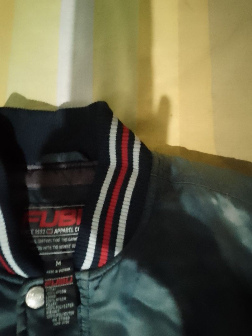 Fubu Vintage varsity jacket (Category: Activewear) located in Bauang. Submitted by mondthrift (Listing ID 1364320777, Image 3). Description: Fubu varsity jacket size medium 22/28 8.5/10 colorate.