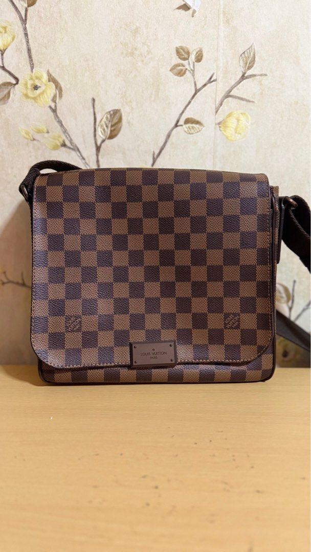 Louis Vuitton Damier Ebene Canvas District PM Bag (Category: Luxury Bags & Wallets) located in Manila. Submitted by lordfarquaad (Listing ID 1364369967, Image 1). Description: ❗️NEGOTIABLE❗️ Key Features: • Style: District PM • Material: Damier Ebene coated canvas with brown textile lining • Hardware: Gold-tone • Closure: Magnetic flap closure • Interior: One large compartment with slip pocket and smaller patch pocket • Strap: Adjustable canvas s