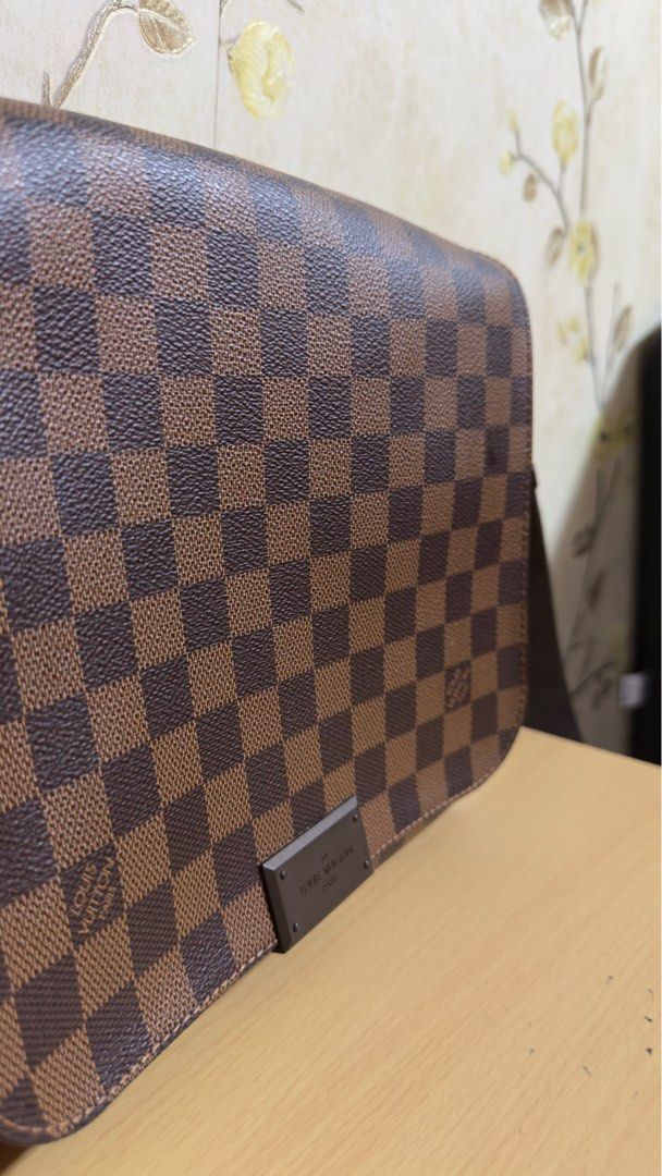 Louis Vuitton Damier Ebene Canvas District PM Bag (Category: Luxury Bags & Wallets) located in Manila. Submitted by lordfarquaad (Listing ID 1364369967, Image 3). Description: ❗️NEGOTIABLE❗️ Key Features: • Style: District PM • Material: Damier Ebene coated canvas with brown textile lining • Hardware: Gold-tone • Closure: Magnetic flap closure • Interior: One large compartment with slip pocket and smaller patch pocket • Strap: Adjustable canvas s