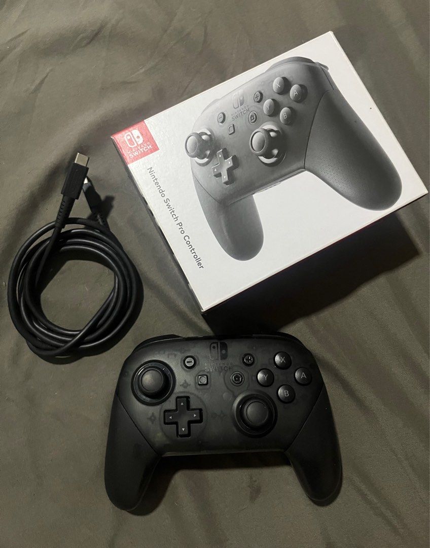 Nintendo Pro Switch Controller (Category: Nintendo) located in Manila. Submitted by acl0413 (Listing ID 1364377890, Image 1). Description: Compatible with: - nintendo switch (OLED model) - nintendo switch - nintendo switch lite - bought from nintendo official store - includes charging cable - shipping to be shouldered by buyer.