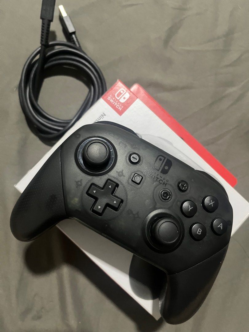 Nintendo Pro Switch Controller (Category: Nintendo) located in Manila. Submitted by acl0413 (Listing ID 1364377890, Image 2). Description: Compatible with: - nintendo switch (OLED model) - nintendo switch - nintendo switch lite - bought from nintendo official store - includes charging cable - shipping to be shouldered by buyer.