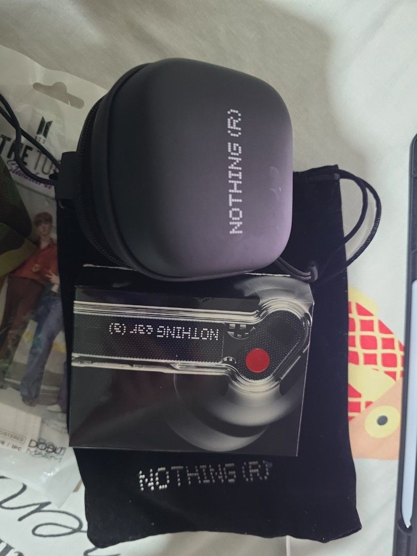 Nothing ear a earbuds (Category: Earphones) located in Singapore. Submitted by gx2318 (Listing ID 1364359715, Image 2). Description: new with pouches and case box.. selling due to lack of bass...