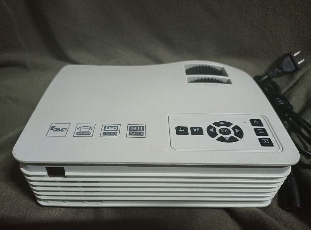 Small projector (Category: Office & Business Technology) located in Quezon City. Submitted by claudiiiee (Listing ID 1364326363, Image 2). Description: Decluttering, havent used the projector in a long time. everything works well, and I can also provide a projector stand for you to be able to attach it to a wall. meet ups: katipunan, bgc, fairview MOP: BDO, BPI, GCASH.