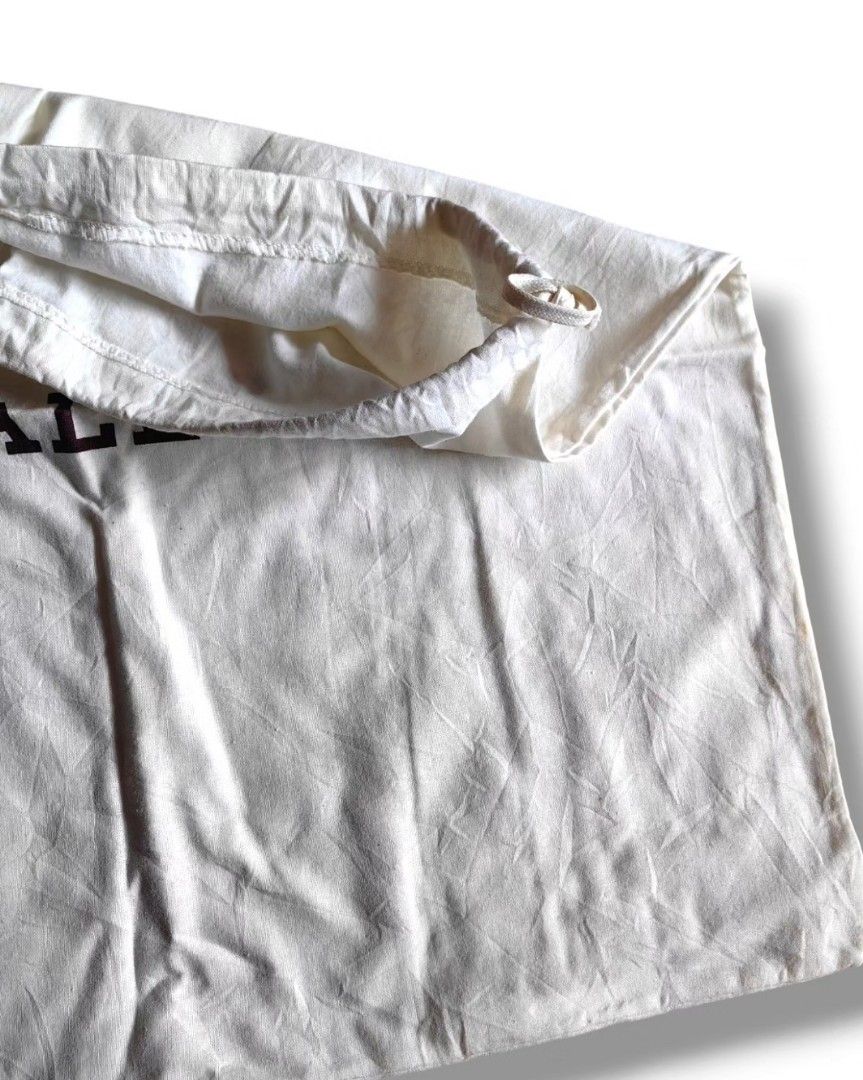 Authentic BALLY dustbag (Category: Luxury Bags & Wallets) located in Quezon City. Submitted by maneradesignersboutique (Listing ID 1364492240, Image 2). Description: Money back Guarantee 💯% Guaranteed authentic *Brand: B*LLY dustbag *Materials: COTTON *Color: Cream white *Size: 19 x 17 INCHES *Condition: pre-loved -Used * Inclusions: NONE Open for LAYAWAY 20% down payment 80% payable in 60 - 90 days with 0 interest at regular posted price. Clien