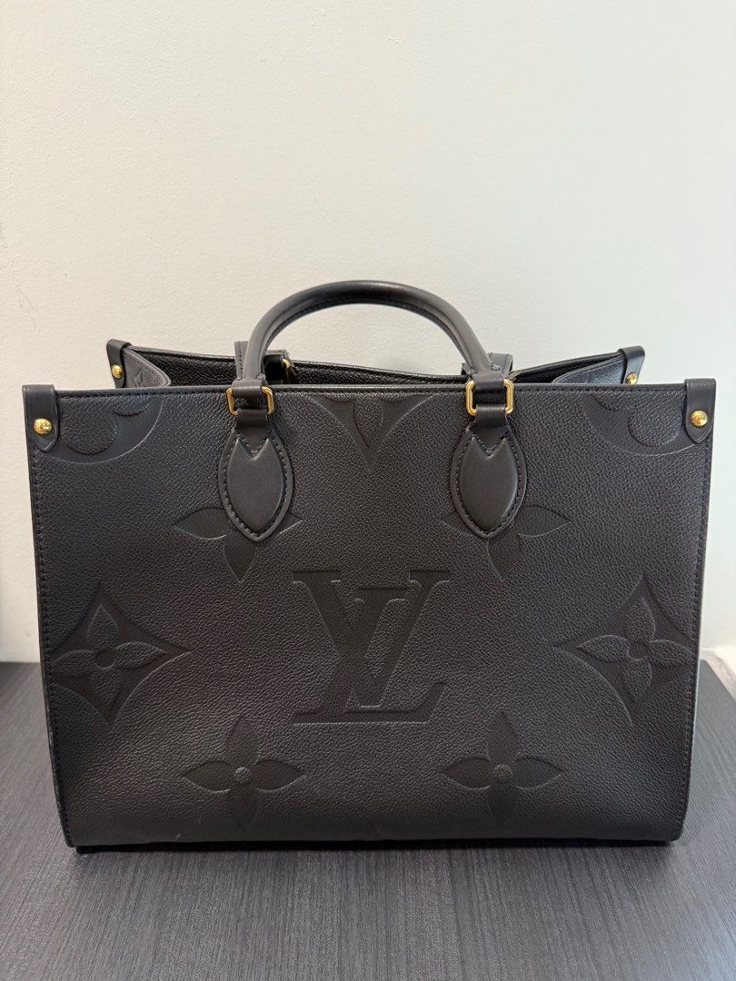Louis Vuitton LV On the go MM tote bag Monogram Empreinte (Category: Bags & Wallets) located in Singapore. Submitted by kimchigal (Listing ID 1364461537, Image 1). Description: Louis Vuitton Onthego MM tote bag in grained Monogram Empreinte 35 x 27 x 14 cm (Length x Height x Width) Comes with full set Current Rrp: $4,800.