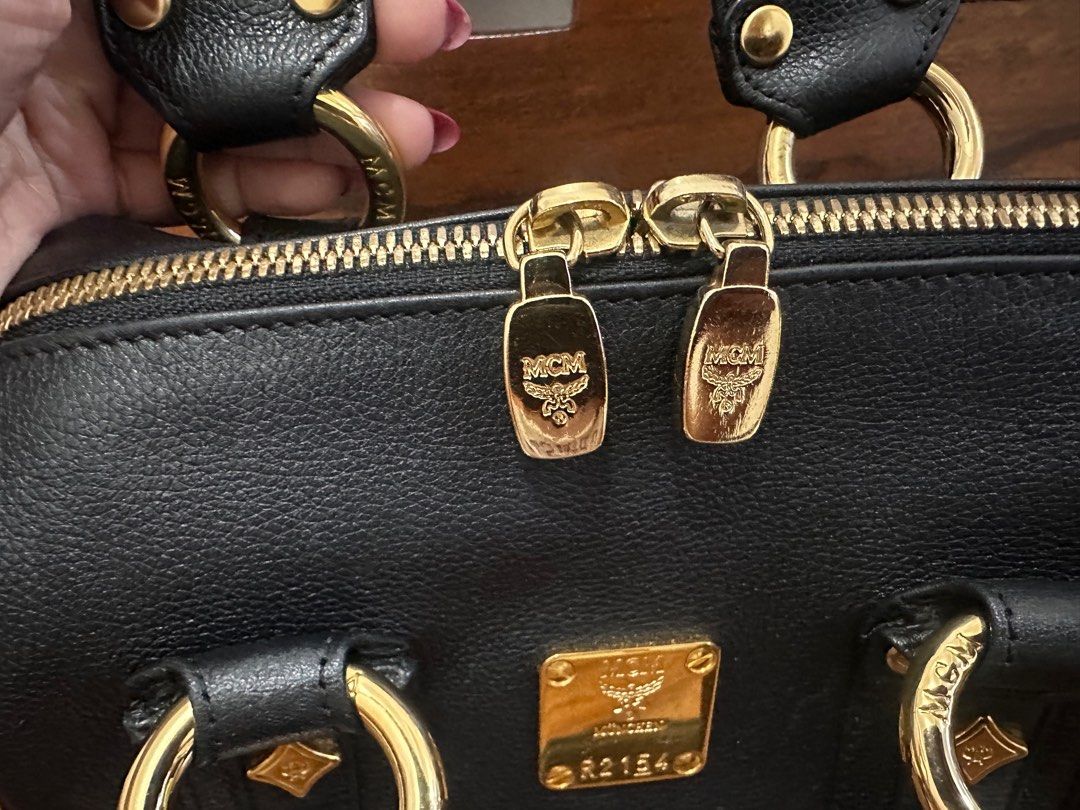 MCM Mini Boston Bag (Category: Luxury Bags & Wallets) located in Makati City. Submitted by petite_preloved2 (Listing ID 1364406796, Image 2). Description: In pristine condition 100% Money Back Authentic Can meet up at the Uptown Mall in BGC Price is slightly negotiable Comes with freebies .