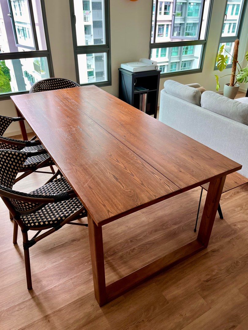 Solid Wood Dining Table (Category: Tables & Sets) located in Singapore. Submitted by dusktoshawn (Listing ID 1364454189, Image 1). Description: Selling my solid wood dining table. The entire table is made of Ash Wood. Tiny scuff that’s not very noticeable shown in the last photo. Dimensions are below: - 200L x 90W x 75H - 2.8 cm table top thickness Please arrange your own delivery / pick up if you’re interested..
