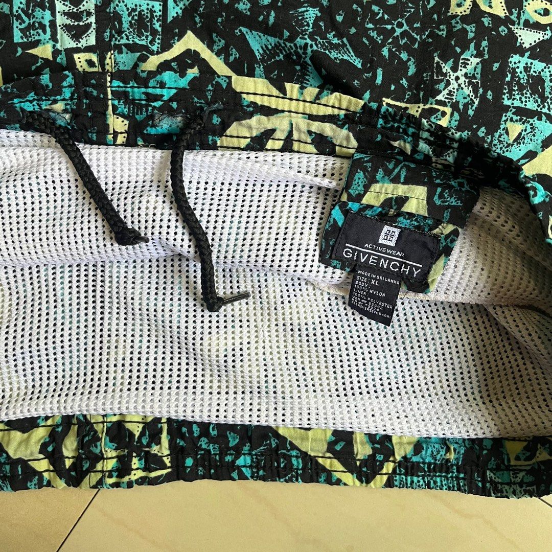 (Thrifted) Vintage Givenchy Shorts/Trunks - (Plus Size) (Category: Shorts) located in Ozamiz City. Submitted by thriftrevival (Listing ID 1364421526, Image 3). Description: This rare vintage piece from Givenchy features a bold tribal-inspired print in shades of black, teal, and cream — perfect for standing out whether you’re at the beach or styling it for everyday wear. Designed for a plus-size fit, these shorts are made from super durable vintag