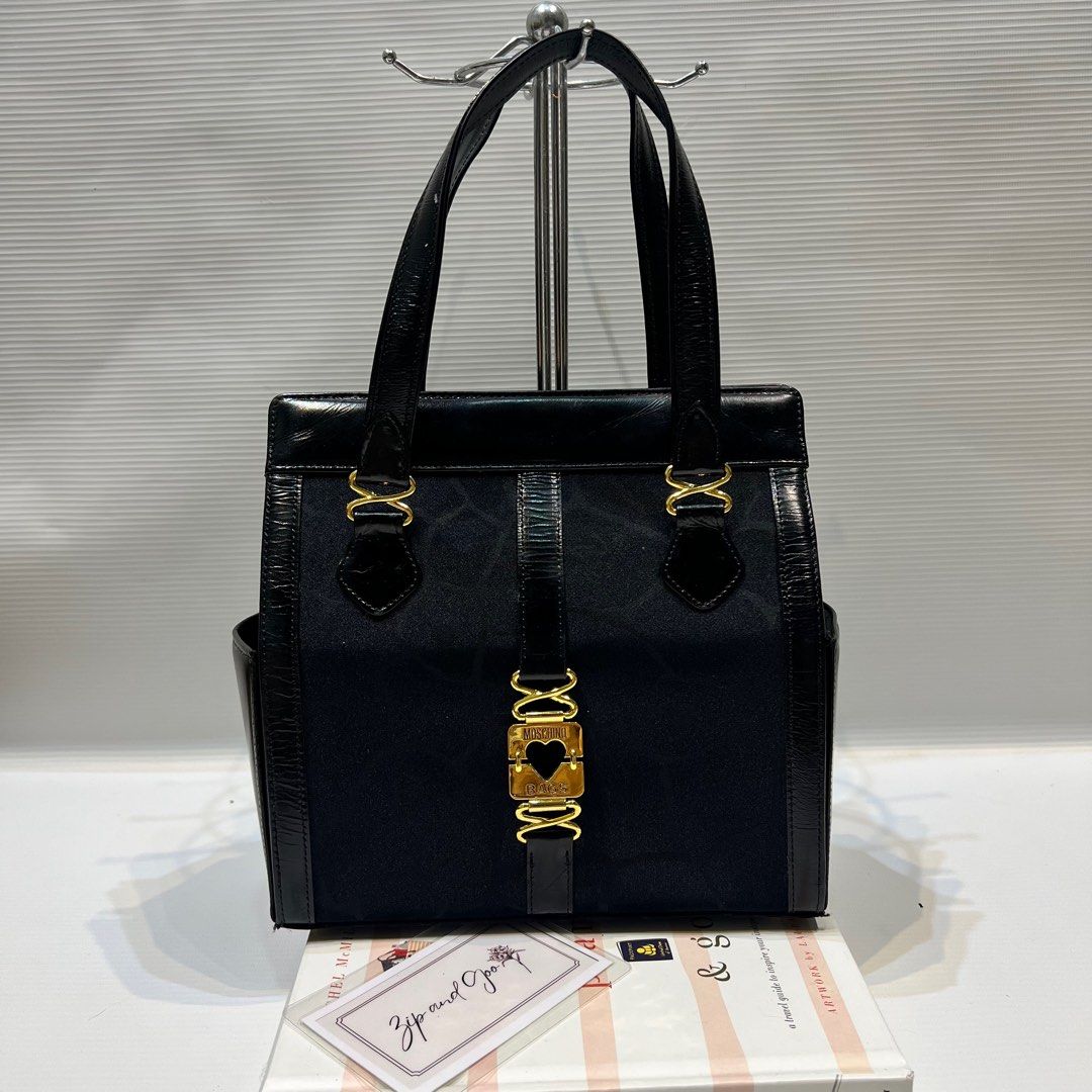 AUTH MOSCHINO BOX TYPE BAG (Category: Luxury Bags & Wallets) located in Manila. Submitted by zipandgoo (Listing ID 1361608753, Image 1). Description: Authentic 💯 In good used condition Clean inside and out Pretty in actual 💌.