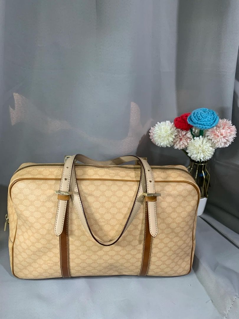 Celine Macadam Boston Hand Bag (Category: Luxury Bags & Wallets) located in Mandaluyong City. Submitted by lalaine_m05 (Listing ID 1361500964, Image 1). Description: Classic design elements typically from the 1980s to early 2000s. Fair: Used with minimal scratches and wrinkles. Color stain on the canvas, part. Length: 14 inch (36 cm) Height: 8.5 inch(22 cm Width: 5 inch (12 cm) .