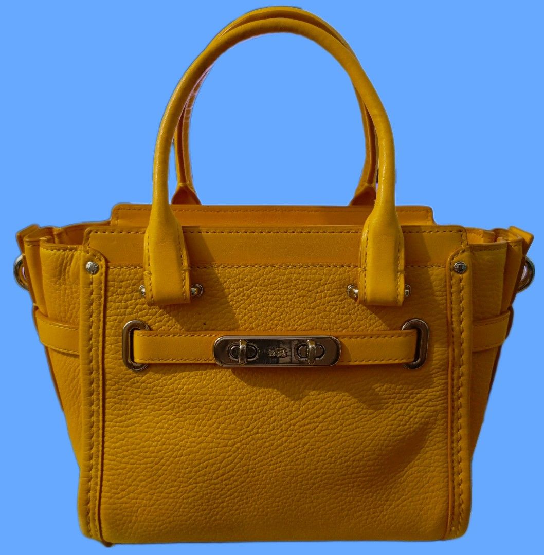 Coach Mini Swagger Bag (Category: Luxury Bags & Wallets) located in San Jose del Monte. Submitted by m_nshop (Listing ID 1361591717, Image 1). Description: with sign of usage with replace sling strap courier:jnt.