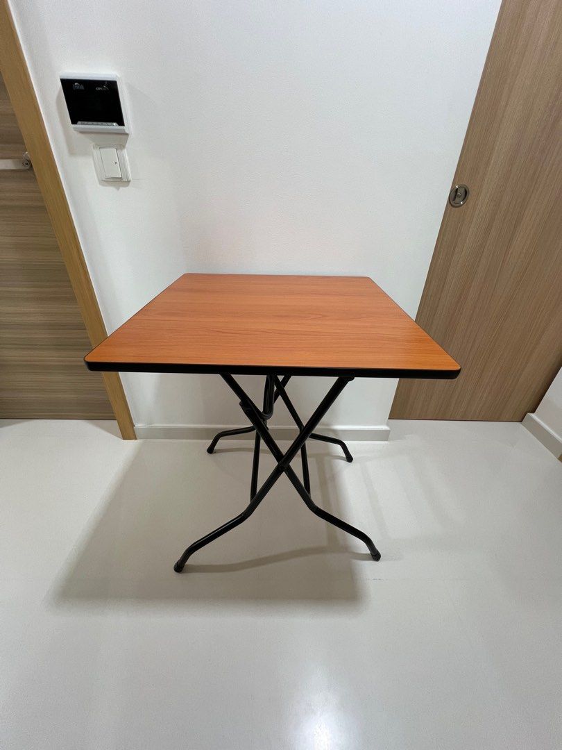 Foldable Table (Square) (Category: Tables & Sets) located in Singapore. Submitted by i_dont_know_what_to_put (Listing ID 1361557930, Image 1). Description: Foldable Wooden Table – Space-Saving & Stylish Upgrade your space with this square foldable table, featuring a tanned brown wood top and a sturdy frame. Perfect for small spaces, it offers both style and convenience. Key Features: ✔ Foldable Design – Easy to store and move when not in use. ✔ P