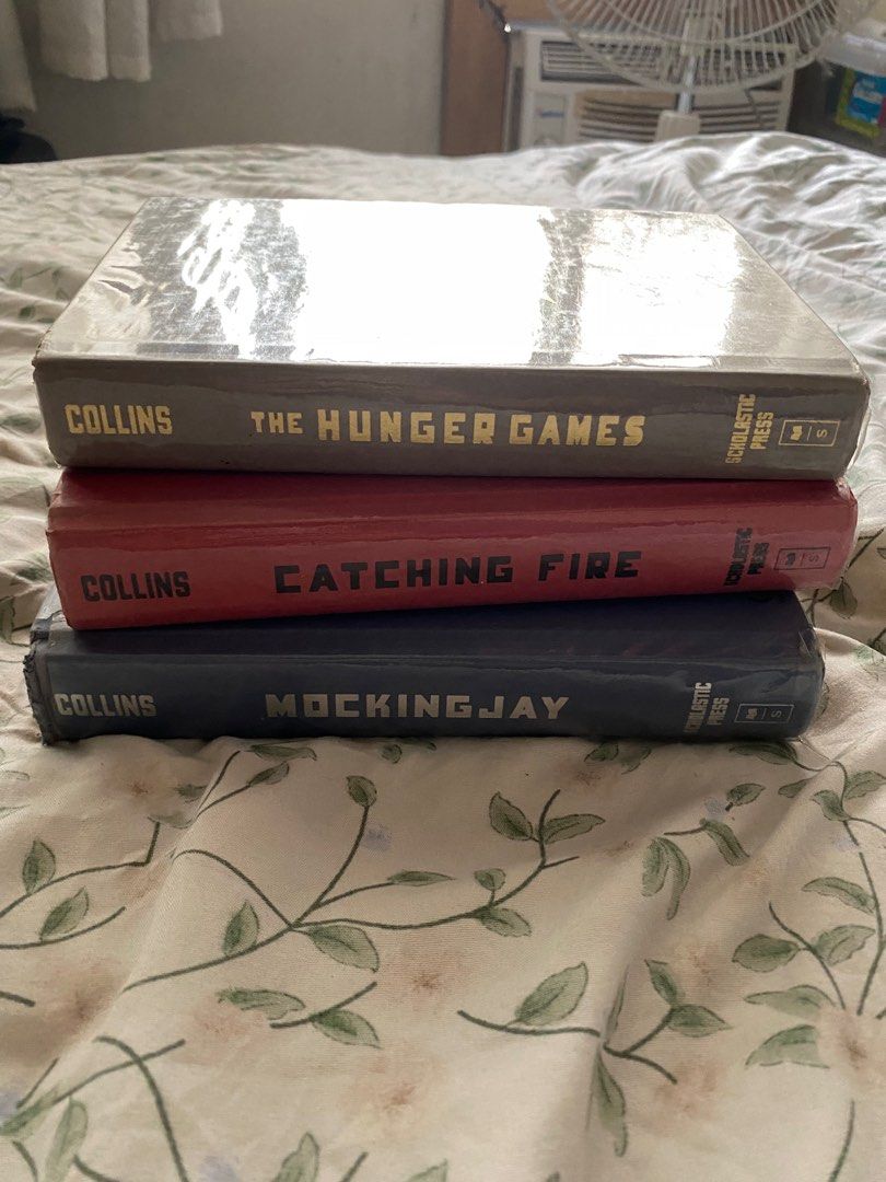 hardbound suzanne collins hunger games series (Category: Storybooks) located in Pasig City. Submitted by petoonie (Listing ID 1361547736, Image 2). Description: — rfs: decluttering — per piece: 150 — prices are negotiable if you buy more than 1 listing ♡ .𖥔 ݁ ˖๋ ࣭ ⭑ thanks for ur interest !! .𖥔 ݁ ˖๋ ࣭ ⭑.