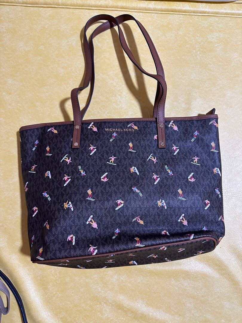 Michael Kors Aspen Jet Tote Bag (Category: Luxury Bags & Wallets) located in Manila. Submitted by matt.murdock17 (Listing ID 1364709631, Image 1). Description: Michael Kors Aspen Medium Top Zip Tote ~ Signature Ski Skier Bag New/NWT Michael Kors Aspen Tote BRAND NEW with Tags Signature PVC with Allover Ski Pattern Zip Top Closure Gold Tone Hardware Michael Kors Spellout Logo on Front Double Handles (10.5” drop) Interior Zip & Slip Pockets MK sign
