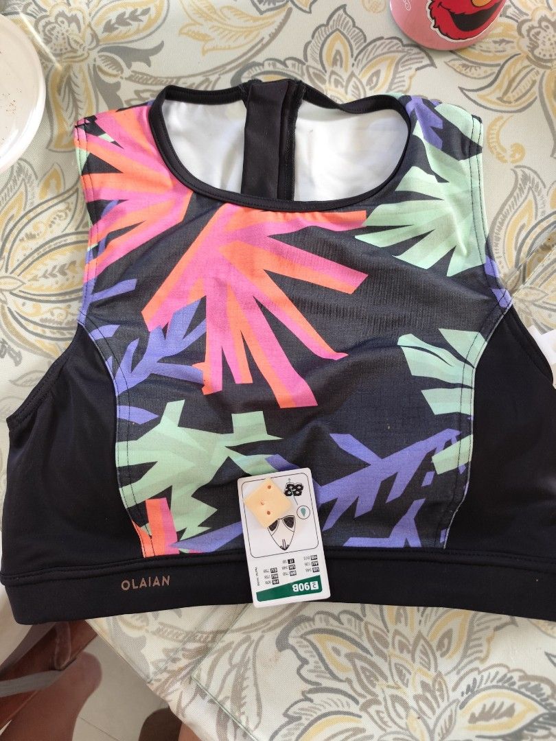 Olaian Surf/Swim Top BNWT (Category: Bikinis & Swimsuits) located in Bacoor. Submitted by deedeiadeng (Listing ID 1364590766, Image 1). Description: Olaian Swim Top High Neck High Back with Zip Pull. With removable quick dry pads. perfect for surfing and other water sports. RFS too small. Slightly negotiable..