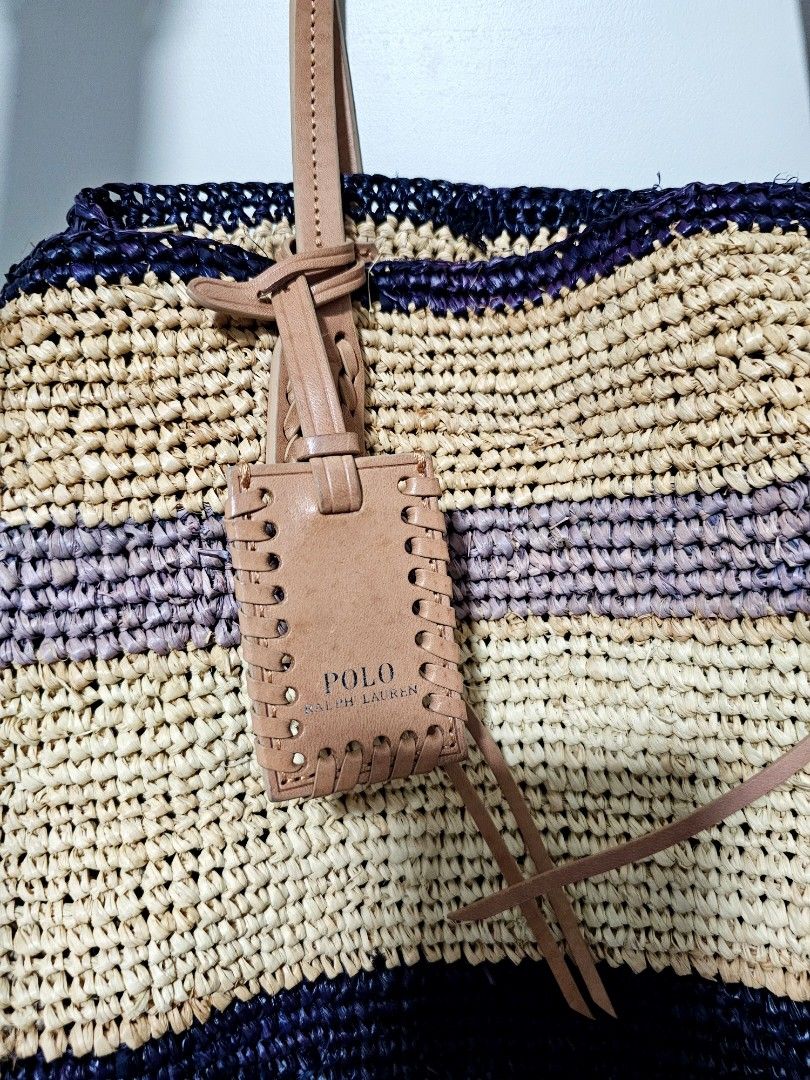 POLO Ralph Lauren Straw Bag (Category: Bags & Wallets) located in Singapore. Submitted by lin_shah (Listing ID 1364719119, Image 3). Description: Ralph Lauren straw tote bag. Leather shoulder straps Comes with a small linen pouch and dust bag. Some discolouration of the straw (blue color) due to storage, but it gave it a rugged look..
