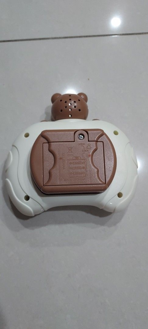 Pop It Fidget Toy with Bear Design in excellent condition (Category: Interactive Toys) located in Singapore. Submitted by wovey (Listing ID 1364688554, Image 2). Description: This is a Pop It fidget toy or quick-push game console with a cute bear design. It has 12 bubbles that you can pop and it makes a satisfying sound. It's a great way to relieve stress and anxiety. It's also a fun toy for kids. It's in lightly used condition and comes with a b