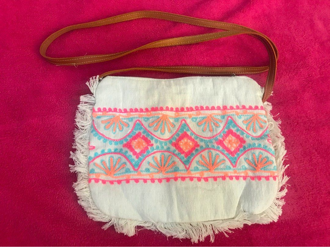 Canvas sling bag (Category: Cross-body Bags) located in Taguig. Submitted by decluttering_my_stuff (Listing ID 1364734953, Image 2). Description: -From Bali with hand embroidered design -never used -9in x 7.5in -Off white RFS: decluttering.