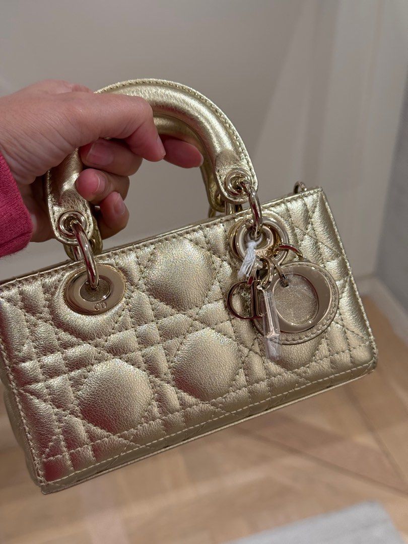 Christian Dior Lady D-Joy Micro in Gold (Category: Luxury Bags & Wallets) located in Makati City. Submitted by samfaves (Listing ID 1364870150, Image 1). Description: Brand new Hard to find color Comes complete dust bag, paper bag receipt , box..