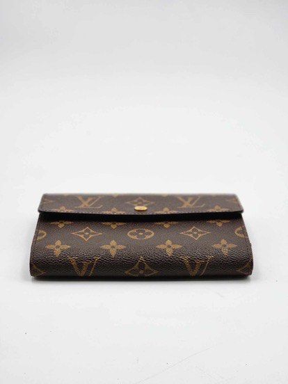 Louis Vuitton (Category: Luxury Bags & Wallets) located in Pasig City. Submitted by emashopaholic (Listing ID 1364821471, Image 3). Description: Preloved Louis Vuitton Monogram Medium wallet Fits a passport holder No inclusions No issues In excellent condition Only ₱17,500 Locatio : Pasig Shipping c/o buyer MOP: Gcash/BDO/BPi.