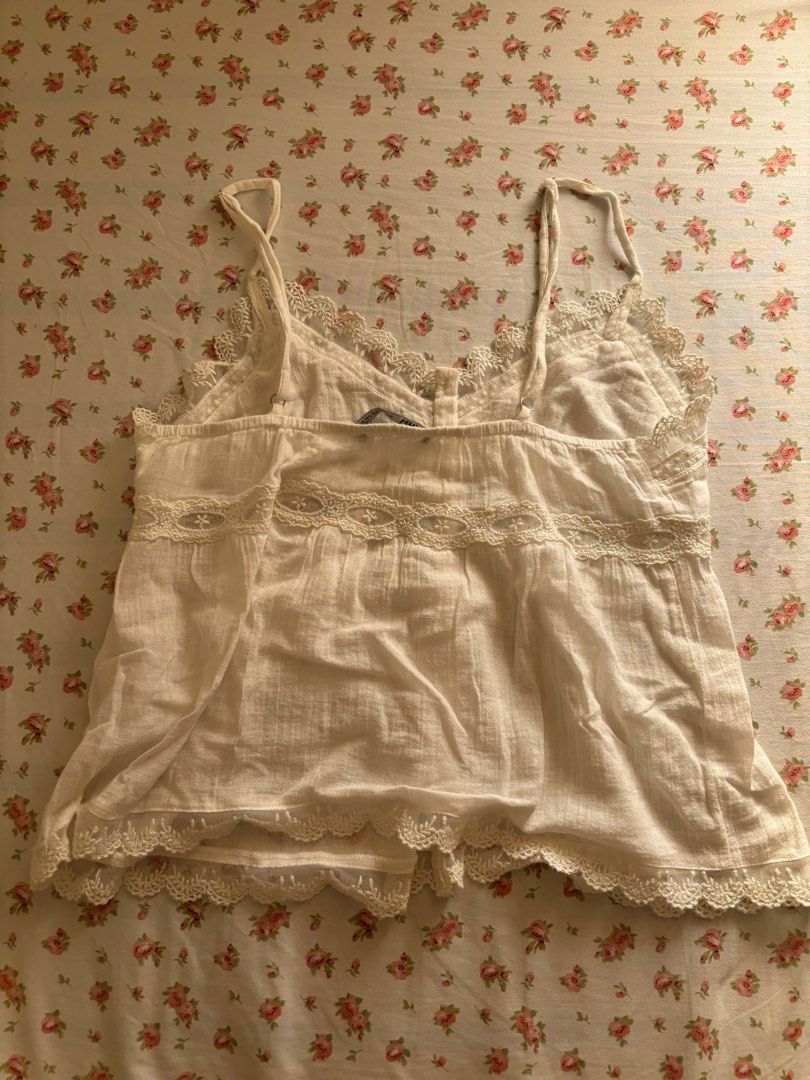 Zara White Cami Lace Coquette Top (Category: Sleeveless) located in Manila. Submitted by polly.studios (Listing ID 1364846165, Image 2). Description: - adjustable straps - so coquette - brandy melville vibes - authentic zara - good quality.