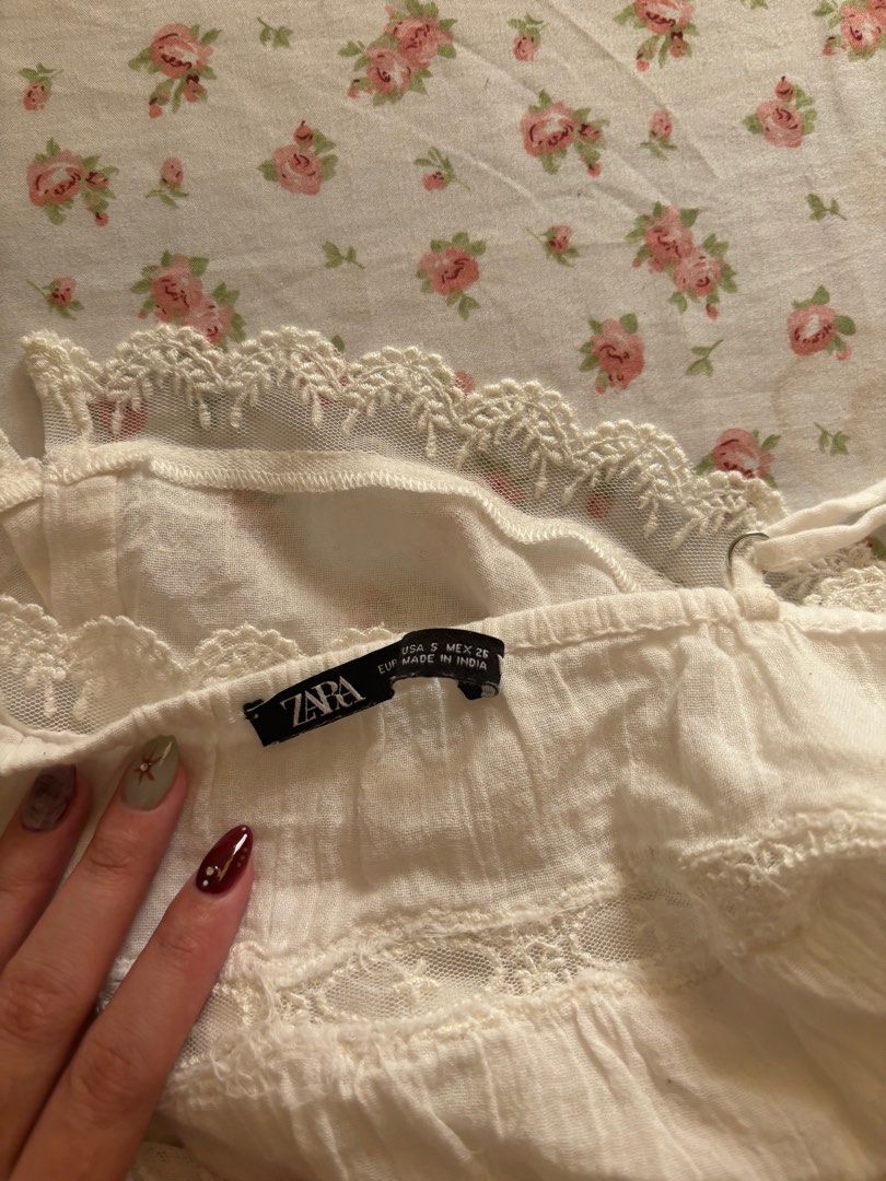 Zara White Cami Lace Coquette Top (Category: Sleeveless) located in Manila. Submitted by polly.studios (Listing ID 1364846165, Image 3). Description: - adjustable straps - so coquette - brandy melville vibes - authentic zara - good quality.