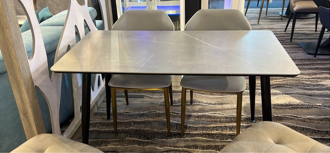 Dining Table Set (Category: Tables & Sets) located in Singapore. Submitted by claytonlim21 (Listing ID 1365012467, Image 3). Description: Sintered stone dining table come with 4 chairs Lenght 130cm Depth 70cm Choice of chairs you can choose We got over 20model chairs Dining table with 4 chairs original price $1199 Delivery free Price before 9% gst Only available @Nova Furnishing Tradehub21 Free delivery Free instalation Why buy from us? Reputable