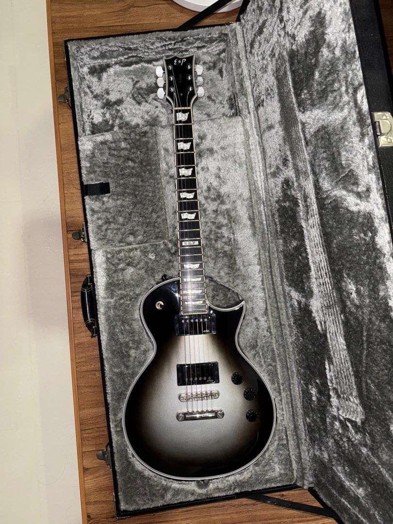 ESP Eclipse Silverburst (Category: Musical Instruments) located in Singapore. Submitted by batzz3177 (Listing ID 1365115818, Image 1). Description: Selling a 2010 ESP Standard series Eclipse in Silverburst. Very Les Paul custom vibes. Guitar is set up with 10-46 strings. Guitar has normal wear from use but the frets are as good as new. Guitar in overall good condition except a chip on the back of the headstock as shown in the last pic which the p