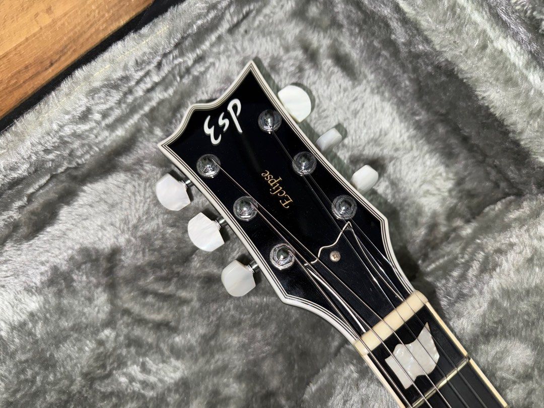 ESP Eclipse Silverburst (Category: Musical Instruments) located in Singapore. Submitted by batzz3177 (Listing ID 1365115818, Image 2). Description: Selling a 2010 ESP Standard series Eclipse in Silverburst. Very Les Paul custom vibes. Guitar is set up with 10-46 strings. Guitar has normal wear from use but the frets are as good as new. Guitar in overall good condition except a chip on the back of the headstock as shown in the last pic which the p
